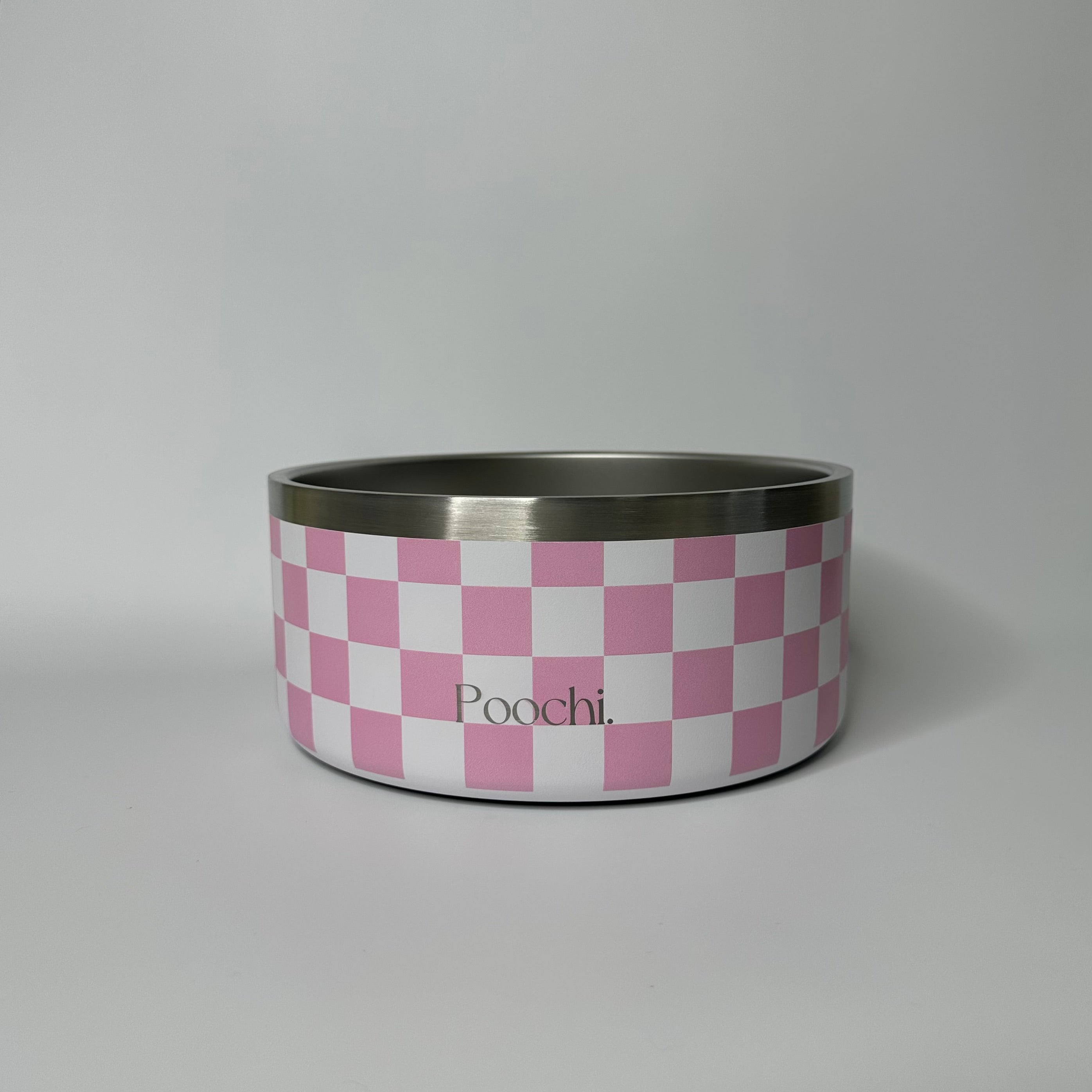 A large stainless steel checkered bowl in pink and white, with a non-slip ring at the base, branded with 'Poochi'.