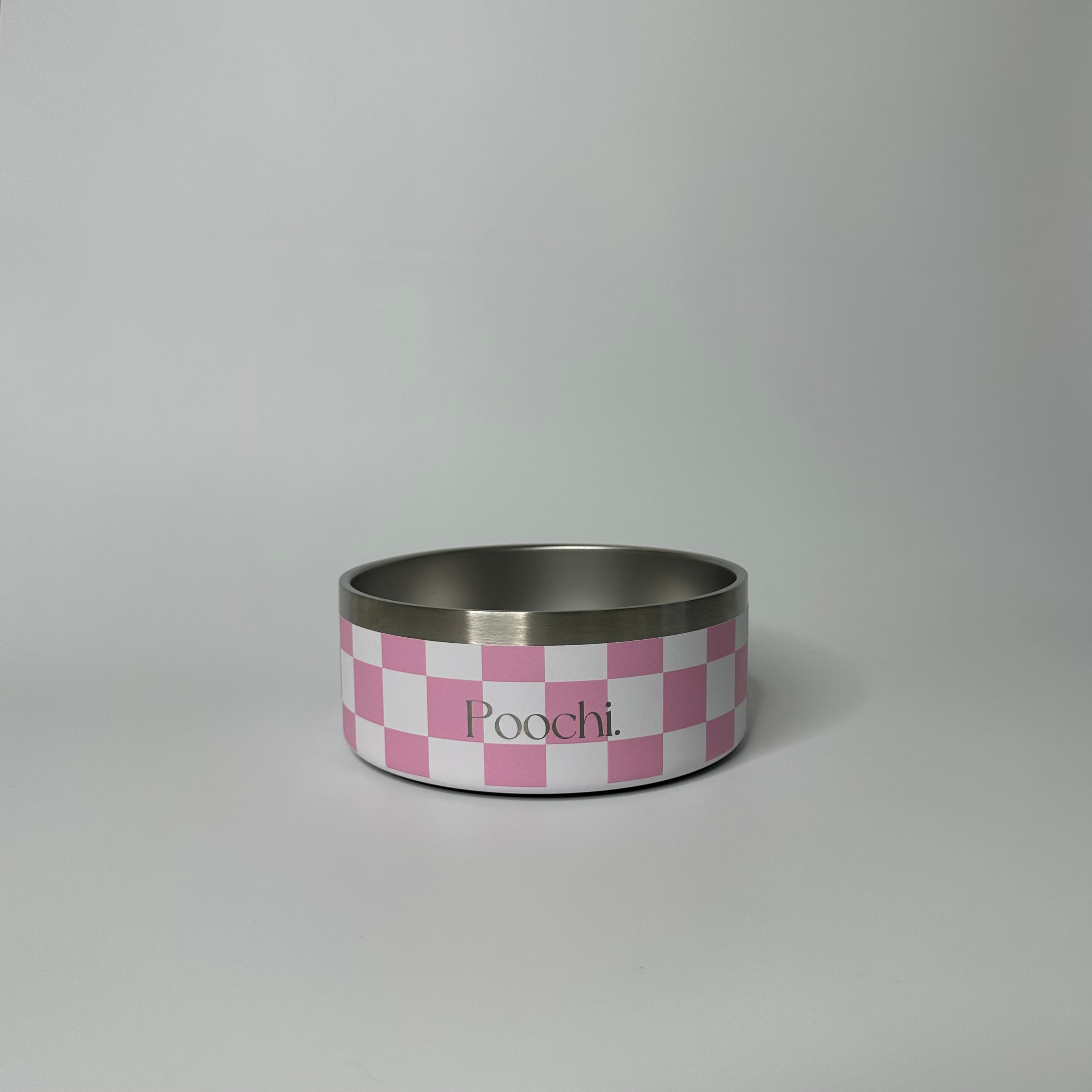 A small stainless steal checkered bowl in pink and white with the brand name 'Poochi' visible on the side.