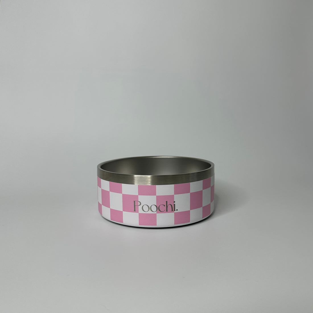 A small stainless steal checkered bowl in pink and white with the brand name 'Poochi' visible on the side.